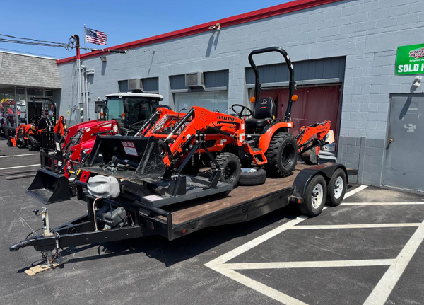 USED 2023 BAD BOY 2024H TRACTOR, 24HP W/LOADER & BACKHOE, 4' CID BRUSH MOWER, 16' TRAILER PACKAGE